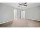 This primary bedroom features carpeted floors and multiple doorways leading to other areas of the house at 3997 Paloverde Nw Dr, Kennesaw, GA 30144