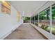 Long screened patio with brick flooring provides a shady outdoor living space at 3997 Paloverde Nw Dr, Kennesaw, GA 30144