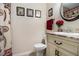 Bathroom featuring decorative shower curtain, framed prints, and vanity with sink at 5086 N Woodbridge Trl, Stone Mountain, GA 30088