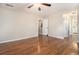 Large bedroom with hardwood floors and ensuite bathroom access at 5086 N Woodbridge Trl, Stone Mountain, GA 30088