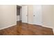 This unfurnished bedroom has hardwood floors with trim and white doors at 5086 N Woodbridge Trl, Stone Mountain, GA 30088
