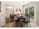 Cozy breakfast nook featuring a round table, tile floors, and a sliding glass door to the backyard at 5086 N Woodbridge Trl, Stone Mountain, GA 30088