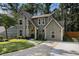 Charming two-story home with a stone accent facade, complemented by a well-manicured lawn and a modern driveway at 5086 N Woodbridge Trl, Stone Mountain, GA 30088