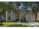 Charming two-story home featuring a stone accent facade, well-manicured lawn, and a cozy, inviting entrance at 5086 N Woodbridge Trl, Stone Mountain, GA 30088