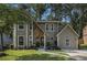 Charming two-story home featuring a stone accent wall, lush lawn, and inviting curb appeal at 5086 N Woodbridge Trl, Stone Mountain, GA 30088