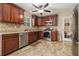 Kitchen showcasing stainless steel appliances, granite countertops, and dark cabinets at 5086 N Woodbridge Trl, Stone Mountain, GA 30088
