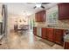 Bright kitchen with cherry wood cabinets, stainless steel appliances, and outdoor access at 5086 N Woodbridge Trl, Stone Mountain, GA 30088