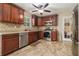 Eat-in kitchen features granite countertops, stainless steel appliances, and cherry wood cabinetry at 5086 N Woodbridge Trl, Stone Mountain, GA 30088