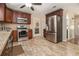 Kitchen with stainless steel appliances, granite countertops, and stylish tile backsplash at 5086 N Woodbridge Trl, Stone Mountain, GA 30088