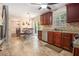 Eat-in kitchen with dark wood cabinets, stainless appliances, and sliding glass doors at 5086 N Woodbridge Trl, Stone Mountain, GA 30088