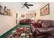 Cozy living room features comfortable seating, a ceiling fan, and stylish decor at 5086 N Woodbridge Trl, Stone Mountain, GA 30088