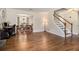 Expansive living area featuring hardwood floors, a fireplace, and seamless transition to the adjacent dining room at 5086 N Woodbridge Trl, Stone Mountain, GA 30088
