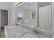 Bright bathroom featuring double sink vanity with granite countertop and stylish fixtures at 1644 Royal Ives Dr, Lawrenceville, GA 30045