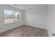 Bedroom featuring large windows and wood flooring at 1644 Royal Ives Dr, Lawrenceville, GA 30045