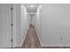 Long view of a hallway featuring access to a number of rooms at 1644 Royal Ives Dr, Lawrenceville, GA 30045