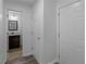 Hallway featuring access to a half bathroom and a closet at 1644 Royal Ives Dr, Lawrenceville, GA 30045