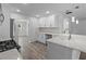 Modern kitchen features stainless steel appliances, white cabinets, and marble countertops at 1644 Royal Ives Dr, Lawrenceville, GA 30045
