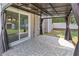 Cozy covered patio with tile flooring and access to the backyard at 1644 Royal Ives Dr, Lawrenceville, GA 30045