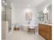 Elegant bathroom featuring a freestanding tub and walk-in shower with dual sinks at 1772 Ridgewood Ne Dr, Atlanta, GA 30307
