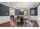 Charming dining room featuring dark accent walls, wainscoting, and an ornate chandelier at 1772 Ridgewood Ne Dr, Atlanta, GA 30307