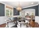Elegant dining room with a round table, seating for six, and a decorative light fixture at 1772 Ridgewood Ne Dr, Atlanta, GA 30307