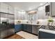 Well-appointed kitchen with stainless steel appliances, white subway tile, and contrasting blue cabinets at 1772 Ridgewood Ne Dr, Atlanta, GA 30307