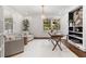 Bright office space with white walls, built-in shelves, a modern desk, and comfortable seating at 1772 Ridgewood Ne Dr, Atlanta, GA 30307