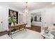 Well-lit office featuring stylish furniture, built-in shelving, and French doors leading to the living room at 1772 Ridgewood Ne Dr, Atlanta, GA 30307
