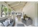 Cozy screened porch with a ceiling fan, a comfortable sofa, and a dining area at 1772 Ridgewood Ne Dr, Atlanta, GA 30307