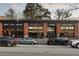 Inviting restaurant exterior with exposed brick, large windows, and street parking at 1772 Ridgewood Ne Dr, Atlanta, GA 30307