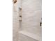 Shower featuring white subway tile and built-in shelving at 1772 Ridgewood Ne Dr, Atlanta, GA 30307