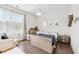 Bright bedroom featuring a wooden bed frame, natural light, and modern decor for a cozy and inviting space at 310 Braeden Way, Alpharetta, GA 30009