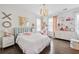 Adorable pink themed bedroom with lots of shelving and a decorative ceiling light at 310 Braeden Way, Alpharetta, GA 30009