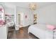 Bright bedroom with decor, desk, and hardwood floors offering lots of natural light at 310 Braeden Way, Alpharetta, GA 30009