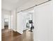 Bright home exercise room with sliding barn doors and modern exercise equipment at 310 Braeden Way, Alpharetta, GA 30009