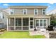 Back exterior showcasing the patio, screened porch and outdoor kitchen at 310 Braeden Way, Alpharetta, GA 30009