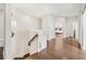Bright hallway with hardwood floors leads to bedrooms with lots of natural light at 310 Braeden Way, Alpharetta, GA 30009