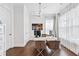 Bright home office with natural light, sleek furniture, and hardwood floors for a productive workspace at 310 Braeden Way, Alpharetta, GA 30009