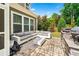 Outdoor patio features a large seating area and built-in grill at 310 Braeden Way, Alpharetta, GA 30009
