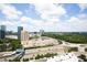 Stunning aerial view showcases city skyline, shopping center and surrounding greenery at 3445 Stratford Ne Rd # 2409, Atlanta, GA 30326