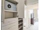 Organized closet with safe, drawers, and clothing rods to maximize storage space at 3445 Stratford Ne Rd # 2409, Atlanta, GA 30326