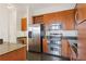 Modern kitchen featuring stainless steel appliances, granite countertops, and wooden cabinetry at 3445 Stratford Ne Rd # 2409, Atlanta, GA 30326