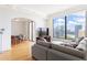 Open living room with hardwood floors, city view and access to dining room at 3445 Stratford Ne Rd # 2409, Atlanta, GA 30326