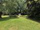 Expansive, well-maintained backyard with lush green grass, ideal for recreation and relaxation at 3545 Manchester Dr, Lawrenceville, GA 30044