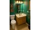 Powder room with a sink and vanity and a matching toilet at 3545 Manchester Dr, Lawrenceville, GA 30044