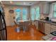 Featuring granite countertops, stainless steel appliances and hardwood floors, perfect for modern cooking and dining at 3545 Manchester Dr, Lawrenceville, GA 30044