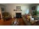 Cozy living room features a fireplace, hardwood floors, and comfortable seating at 3545 Manchester Dr, Lawrenceville, GA 30044