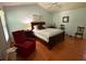 Spacious primary bedroom with a vaulted ceiling, wood floors, and lots of natural light at 3545 Manchester Dr, Lawrenceville, GA 30044