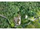 Aerial view showcasing the property's wooded lot, proximity to the road, and detached garage at 528 Pumpkinvine Rd, Acworth, GA 30101