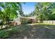 Beautiful home showcasing a large backyard, mature trees, and wooded surroundings at 528 Pumpkinvine Rd, Acworth, GA 30101